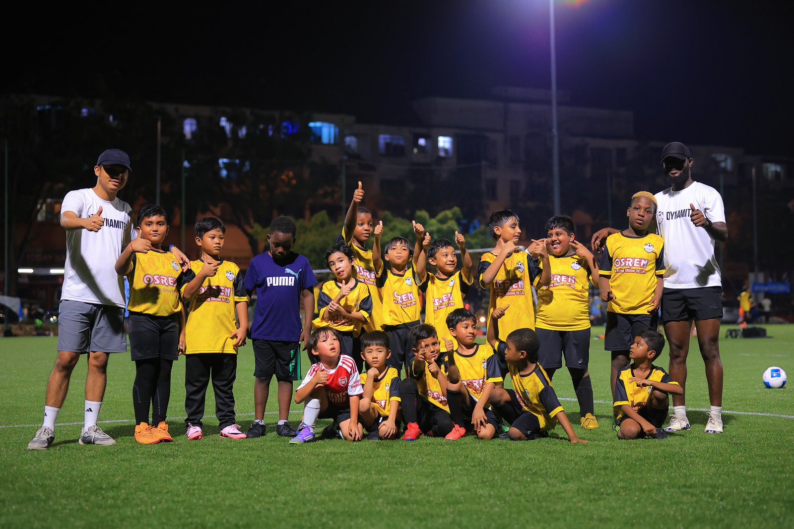 Team photo with coaches at night